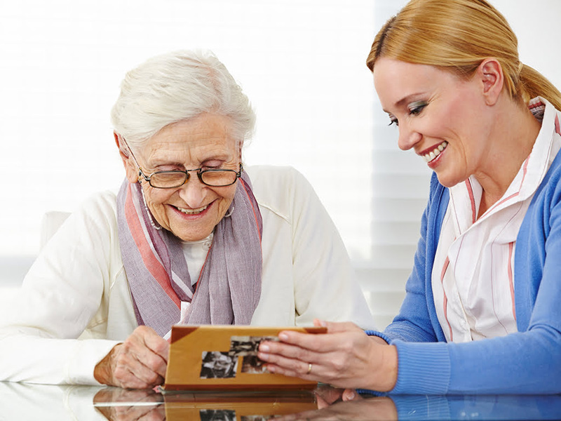 Older woman with younger nurse