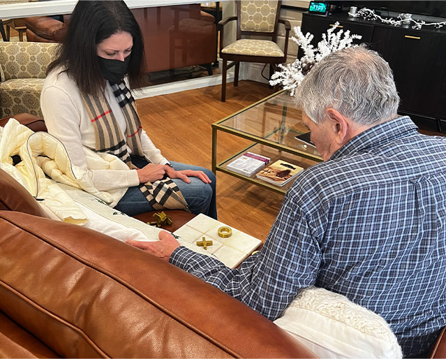 Two people playing Tic Tac Toe